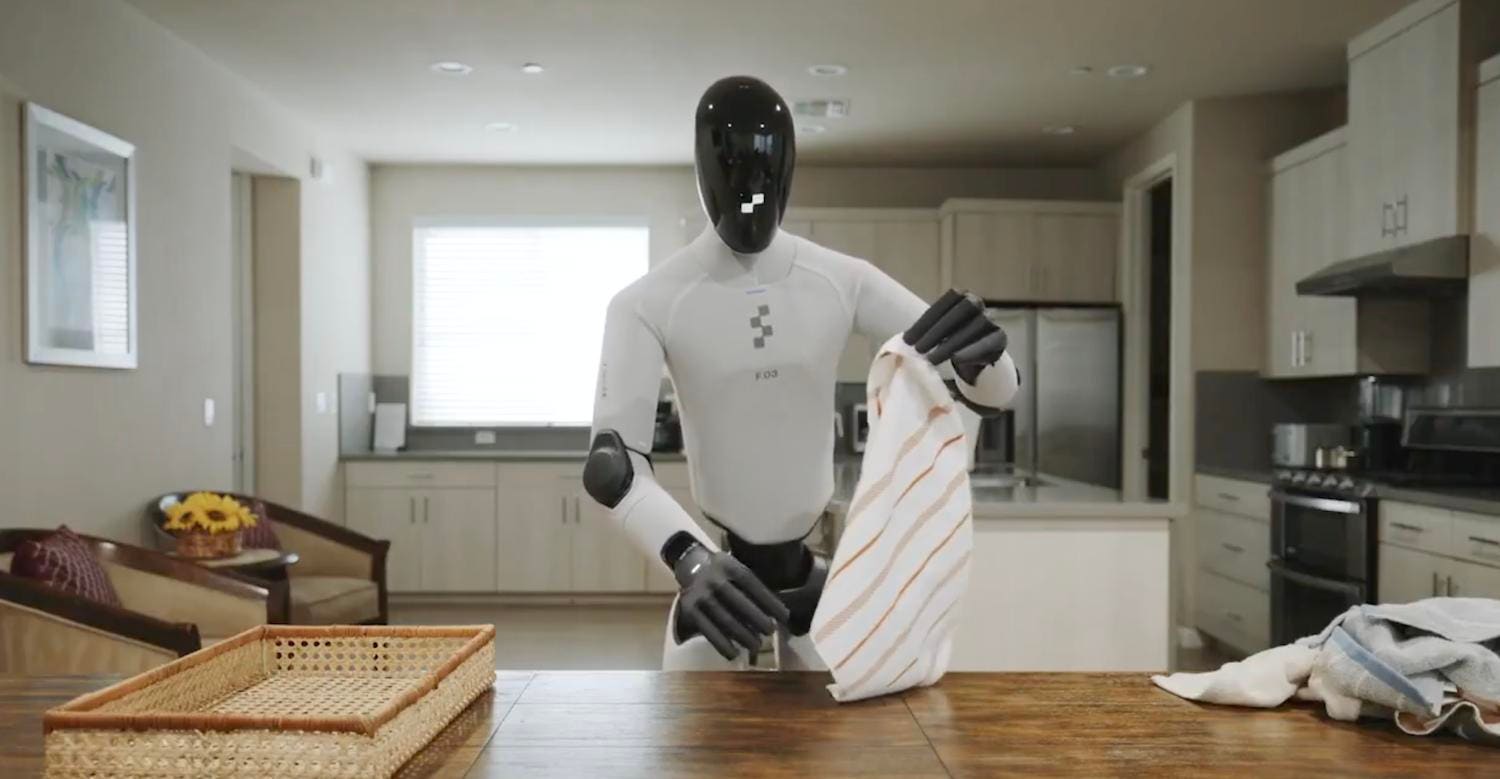 Snimka zaslona s Figureova prijenosa uživo: humanoid Figure 03 obavlja kućanske poslove